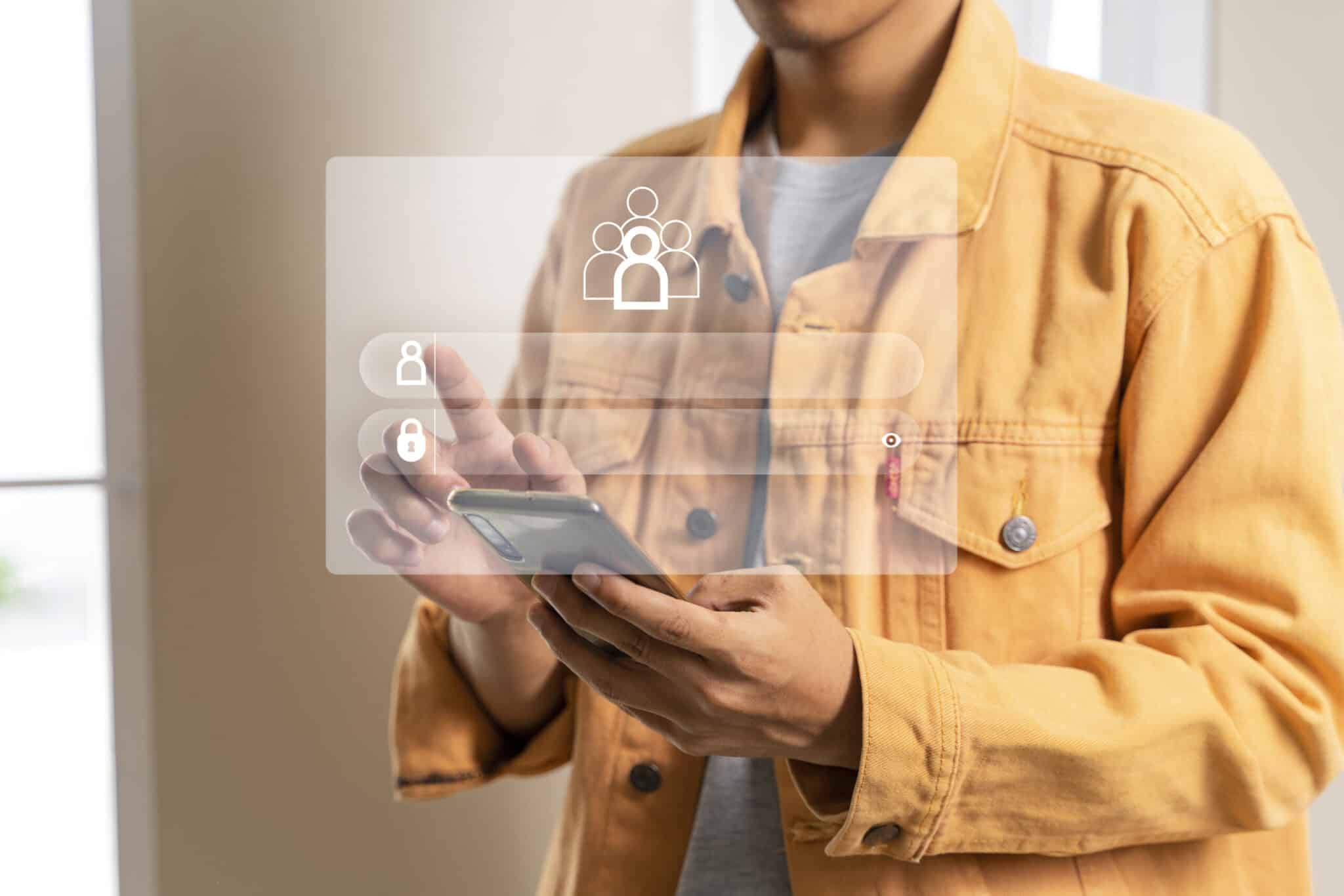 Homem com celular na mão em uma interface de login representando a gestão de dados